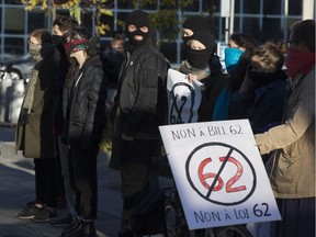 October 20, 2017 --  Protestors participate in a demonstration against Bill 62 on the No. 80 bus route at Parc Metro station in Montreal, October 20, 2017.