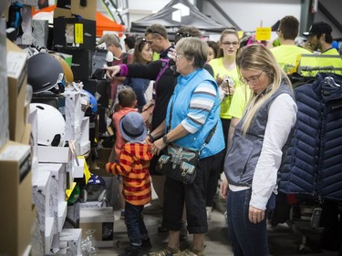 Jennifer Brousseau checks out some deals on helmets at the Ottawa Ski, Snowboard and Travel Show at the EY Centre.