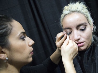 Amanda Guillen does Shelby Del Franko's lashes before a fashion show during the National Women's Show that took place Saturday, Oct. 21, 2017 at the EY Centre.