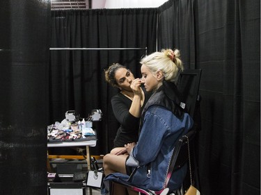 Amanda Guillen does Shelby Del Franko's lashes before a fashion show during the National Women's Show that took place Saturday, Oct. 21, 2017 at the EY Centre.