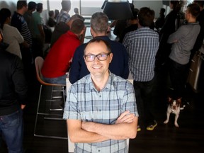 Allan Wille, President and CEO of Klipfolio, in their downtown Ottawa offices, which have a young friendly vibe and are also dog friendly. Rocco (lower right), is one of the many mascots in the office.