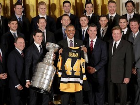 Penguins team members and NHL commissioner Gary Bettman, front left, visit with then-President Barack Obama at the White House on Oct. 6, 2016. The Penguins are scheduled to visit President Donald Trump at the White House in Washington on Tuesday. Chip Somodevilla/Getty Images