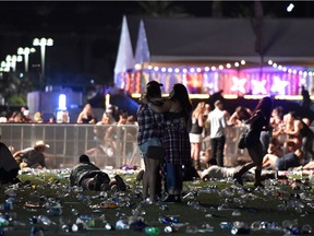 People run from the Route 91 Harvest country music festival after gunfire breaks out Oct. 1 in Las Vegas.