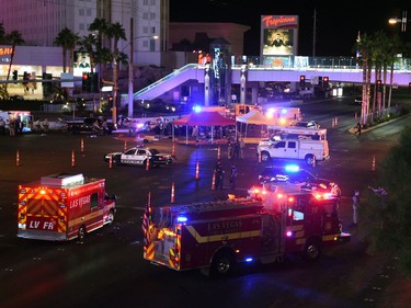 Police and rescue personnel gather at the intersection of Las Vegas Boulevard and Tropicana Ave. after a reported mass shooting at a country music festival on October 2, 2017 in Las Vegas, Nevada. A gunman has opened fire on a music festival in Las Vegas, leaving at least 2 people dead. Police have confirmed that one suspect has been shot. The investigation is ongoing.