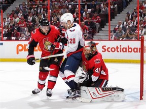 Mark Borowiecki and Craig Anderson of the Ottawa Senators defend against Lars Eller of the Washington Capitals in the first period at the Canadian Tire Centre on Thursday, Oct. 5, 2017.