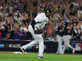 Relief pitcher Aroldis Chapman celebrates the final out of the ninth inning that clinched a 1-0 win against the Indians during Game 3 of the American League Divisional Series on Sunday night.  Al Bello/Getty Images