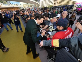 Marc-Andre Fleury #29 of the Vegas Golden Knights signs autographs for fans as he arrives at the team's inaugural regular-season home opener against the Arizona Coyotes at T-Mobile Arena on October 10, 2017 in Las Vegas, Nevada.