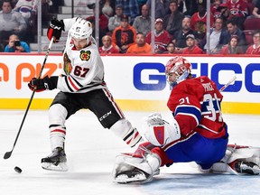 Tanner Kero #67 of the Chicago Blackhawks tries to get a shot on goaltender Carey Price #31 of the Montreal Canadiens during the NHL game at the Bell Centre on October 10, 2017 in Montreal, Quebec, Canada.  The Chicago Blackhawks defeated the Montreal Canadiens 3-1.