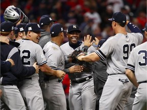 Aroldis Chapman #54 of the New York Yankees celebrates with teammates after their 5 to 2 win over the Cleveland Indians in Game Five of the American League Divisional Series at Progressive Field on October 11, 2017 in Cleveland, Ohio.  (Photo by Gregory Shamus/Getty Images)