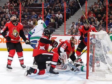 Brock Boeser #6 of the Vancouver Canucks celebrates his first period power-play goal as Nate Thompson #17, Johnny Oduya #29, Craig Anderson #41 and Cody Ceci #5 of the Ottawa Senators react at Canadian Tire Centre on October 17, 2017 in Ottawa, Ontario, Canada.  (Photo by Jana Chytilova/Freestyle Photography/Getty Images)
