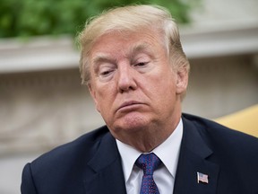 President Donald Trump speaks to the media during a meeting with Governor Ricardo Rossello of Puerto Rico in the Oval Office at the White House on October 19, 2017 in Washington, D.C.