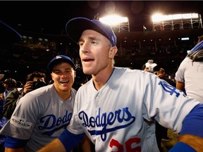 Chase Utley #26 of the Los Angeles Dodgers celebrates after defeating the Chicago Cubs 11-1 in game five of the National League Championship Series at Wrigley Field on October 19, 2017 in Chicago, Illinois. The Dodgers advance to the 2017 World Series.