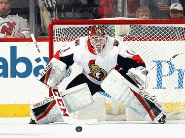 Senators goalie Mike Condon tracks the puck during the first period against the Devils on Friday night.  Bruce Bennett/Getty Images