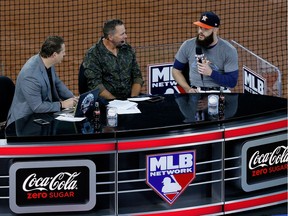 Dallas Keuchel, right, of the Astros speaks to the media before Game 4 of the 2017 World Series against the Dodgers on Saturday night.  Bob Levey/Getty Images

No more than 7 images from any single MLB game, workout, activity or event may be used (including online and on apps) while that game, activity or event is in progress.
Bob Levey, Getty Images