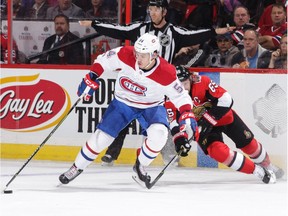 Charles Hudon of the Canadiens swoops past the Senators' Erik Karlsson on the way to scoring his first goal of the game on Monday night.  Jana Chytilova/Freestyle Photography/Getty Images