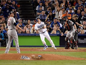 Joc Pederson of the Dodgers hits a solo home run during the seventh inning for an insurance run against the Astros on Tuesday night. Kevork Djansezian/Getty Images