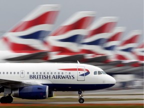 A British Airways plane lands at Heathrow Airport.