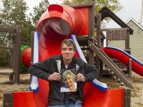 Neil Durling holds a photo of his mother, Mary, in what is now Cypress Gardens Park in Stittsville. On Friday, the park will be renamed Mary Durling Park in her honour.