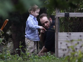 Joshua Boyle and his son, Jonah, play in the garden at his parents' home in Smiths Falls on Saturday, Oct. 14, 2017.