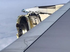 This photo obtained on the twitter account of @Bdaddy1391 and taken on  September 30, 2017 shows the damaged engine of an Air France A380 superjumbo while onboard before it made an emergency landing in Canada
