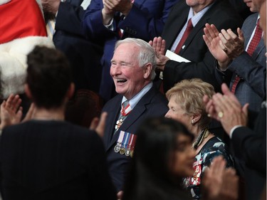 The outgoing Governor General David Johnston receives a standing ovavtion in the senate in Ottawa, Ontario, October 2, 2017.  The former astronaut Julie Payette will become the 29th Governor General of Canada later this morning.