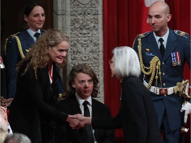 The Governor general Julie Payette(L) shakes hands with Beverley McLachlin chief justice of the supreme court of Canada in the Senate in Ottawa, Ontario, October 2, 2017.  Former astronaut Julie Payette will become the 29th Governor General of Canada.