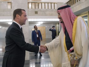 Saudi King Salman bin Abdulaziz Al Saud (R) shaking hands with Russian Prime Minister Dmitry Medvedev in Moscow, October 6, 2017.