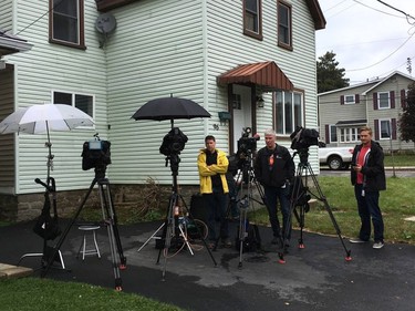 Journalists wait outside the house of Canadian hostage Joshua Boyle's parents in Smiths Falls.
