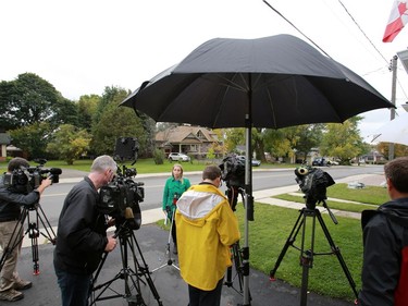 Journalists work outside freed Canadian hostage Joshua Boyle's family home in Smiths Falls on October 14, 2017.