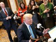 US President Donald Trump takes part in a series of radio interviews in the Eisenhower Executive Office Building, next to the White House, on October 17, 2017. There are many differences between the characters in today's tensions between the U.S. and North Korea and the Cuban Missile Crisis, writes Andrew Cohen. MANDEL NGAN, AFP/Getty Images