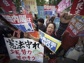 Protesters gather after an election was called in late September. On sale this election season, writes Shannon Gormley, is militarism, and Japan should seriously weigh these decisions. Eugene Hoshiko, AP