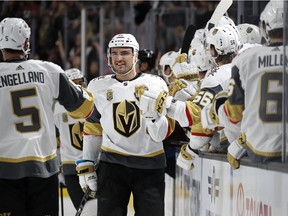 Vegas Golden Knights left wing William Carrier, right, celebrates after scoring against the Colorado Avalanche during the third period of an NHL hockey game Friday, Oct. 27, 2017, in Las Vegas.