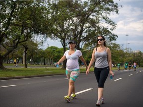 Pregnant athlete, left, participates in marathon relay in Rio de Janeiro in this 2013 file photo.