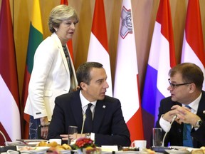 Austrian Social Democrat Chancellor Christian Kern, centre, attends an EU summit in Brussels Oct. 20 with Britain's Theresa May (standing) and Finnish Prime Minister Juha Sipila. The problem of dealing with "right-wing" parties isn't unique to one country, writes Austria's ambassador to Canada.