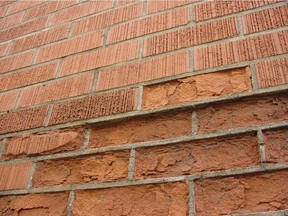 The deteriorating brick here didn't meet Canadian standards for weather resistance and water absorption. Canada has some of the toughest standards for bricks made to withstand all the freeze-thaw cycles we get each winter.