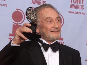 In this file photo dated Sunday, June 4, 2000, Roy Dotrice poses with his Tony award for Best Featured Actor in a Play for his work in "A Moon For The Misbegotten," at the 54th annual Tony Awards ceremony in New York.  The family of veteran British actor Roy Dotrice said Monday Oct. 16, 2017, that he has died aged 94, in his London home.