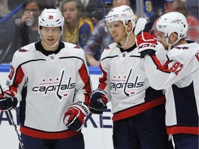 'They gave me the opportunity to play with some great players in the preseason. I thought I was able to show some of the good things I do,' said Alex Chiasson, left, seen in an exhibition game with the Capitals' John Carlson and Evgeny Kuznetsov.