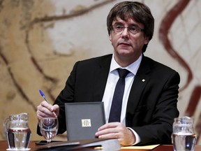 Catalonian president Carles Puigdemont attends a regional government meeting at the Generalitat Palace in Barcelona on Oct. 10, 2017.