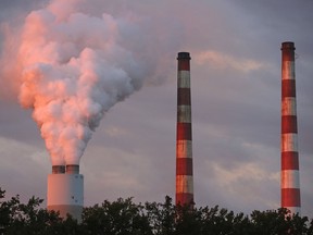 Emissions spew out of a large stack at the coal-fired Morgantown Generating Station on Oct. 10, 2017 in Newburg, Maryland.