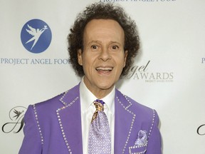 In this Aug. 10, 2013 file photo, fitness guru Richard Simmons arrives at the Project Angel Food's 2013 Angel Awards in Los Angeles. The creator of a hit podcast that investigated the health and wellbeing of Richard Simmons says he believes the now-reclusive fitness legend is fine and he has no regrets about the show that some critics felt was an invasion of the celebrity's personal life. THE CANADIAN PRESS/AP-Photo by Richard Shotwell/Invision/AP, File