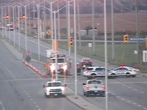 Repair crews and police on Fallowfield Thursday morning.