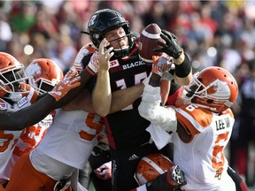 Redblacks quarterback Ryan Lindley tries to control the ball as he attempts a quarterback sneak against the Lions during the teams' Aug. 26 game in Ottawa. THE CANADIAN PRESS/Justin Tang