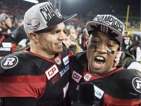 Redblacks QB Trevor Harris, left, celebrates with the now-retired Henry Burris after the Redblacks' overtime win against the Stampeders in the 2016 Grey Cup. That, however, was in Toronto. Imagine the scene if the home team was in this year's Grey Cup in Ottawa.  THE CANADIAN PRESS/Ryan Remiorz