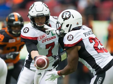 Trevor Harris, William Powell

Ottawa Redblacks' quarterback Trevor Harris, left, hands off to William Powell during the first half of a CFL football game against the B.C. Lions in Vancouver, B.C., on Saturday, October 7, 2017. THE CANADIAN PRESS/Darryl Dyck ORG XMIT: VCRD133
DARRYL DYCK,