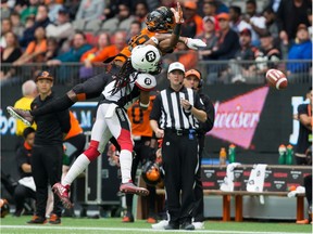 Redblacks defensive back Sherrod Baltimore makes sure the Lions' Shaq Johnson can't make the catch on this pass by Jonathon Jennings in the first half of Saturday's contest at B.C. Place stadium in Vancouver. THE CANADIAN PRESS/Darryl Dyck