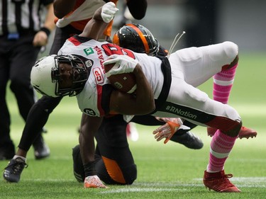 William Powell, Micah Awe

Ottawa Redblacks' William Powell, front, dives past B.C. Lions' Micah Awe while carrying the ball during the first half of a CFL football game in Vancouver, B.C., on Saturday, October 7, 2017. THE CANADIAN PRESS/Darryl Dyck ORG XMIT: VCRD113
DARRYL DYCK,