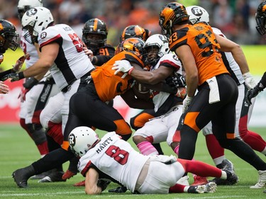 Micah Awe, William Powell

Ottawa Redblacks' William Powell, centre right, is stopped by B.C. Lions' Micah Awe (51) during the first half of a CFL football game in Vancouver, B.C., on Saturday, October 7, 2017. THE CANADIAN PRESS/Darryl Dyck ORG XMIT: VCRD114
DARRYL DYCK,
