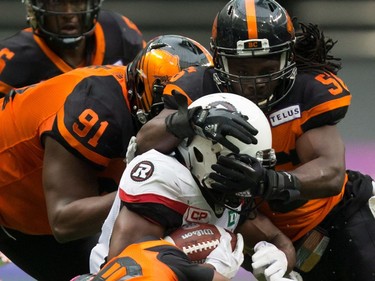 William Powell, Junior Luke, Solomon Elimimian, Chandler Fenner

Ottawa Redblacks' William Powell, centre, is tackled by B.C. Lions' Junior Luke (91), Solomon Elimimian (56) and Chandler Fenner, bottom, during the first half of a CFL football game in Vancouver, B.C., on Saturday, October 7, 2017. THE CANADIAN PRESS/Darryl Dyck ORG XMIT: VCRD121
DARRYL DYCK,