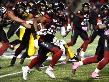 Redblacks wide receiver Diontae Spencer (85) runs the ball against the Tiger-Cats during second-half action on his way to a CFL record for total yards in a single game. THE CANADIAN PRESS/Justin Tang