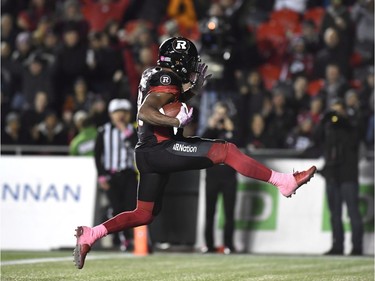 Redblacks running back William Powell (29) kicks his feet in celebration as he runs in the end zone after scoring a touchdown against the Tiger-Cats during the fourth quarter of play on Friday night. THE CANADIAN PRESS/Justin Tang